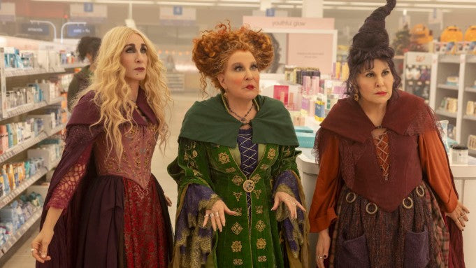 Witches standing in makeup section of store